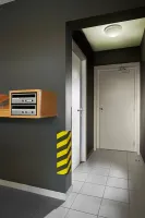 Černo-žlutá pěnová ochrana rohů zdí, stěn - délka 50 cm, šířka 12,5 x 12,5 cm, tloušťka 2,5 cm